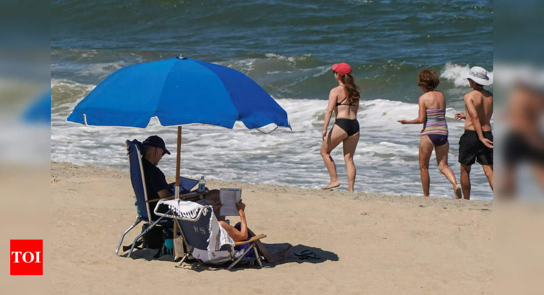 Joe Biden hits the beach - and ditches the shirt